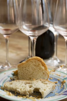 leftover bread with wine glasses in the background