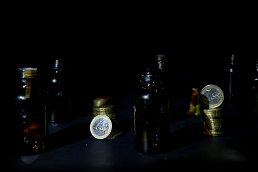 finance and healthcare with coins next to medicine bottles