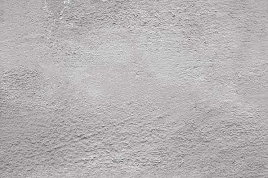 Texture of peeling old gray paint on the wall. Design pattern, wall texture, plaster background.