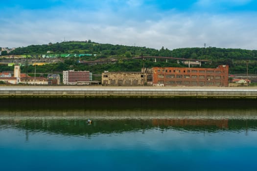 Abandoned industrial buildings along the Nervion River, Bilbao Basque Country, Spain