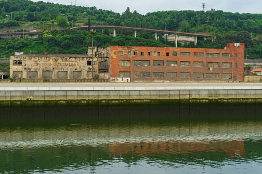 Abandoned industrial buildings along the Nervion River, Bilbao Basque Country, Spain