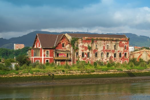 An old abandoned house on the outskirts of Bilbao, on the Nervion River