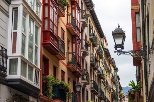 narrow streets with colorful balconies, Bilbao, Spain.