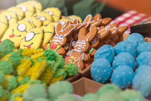 Sweet pastries with rainbow icing in a pastry shop. High quality photo