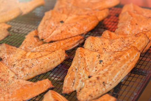 Grilled Atlantic salmon fillet. The process of smoking red fish fillet. High quality photo