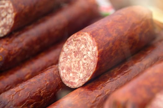 Fresh smoked sausage in the store. Choice of smoked meat products. Selection of sausages in the store