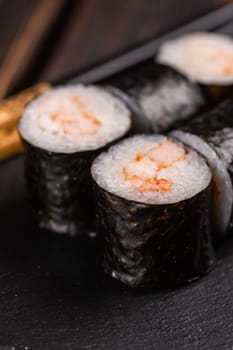 Maki shrimp sushi. Shrimp fillet stuffing wrapped in rice and nori seaweed. Japanese food