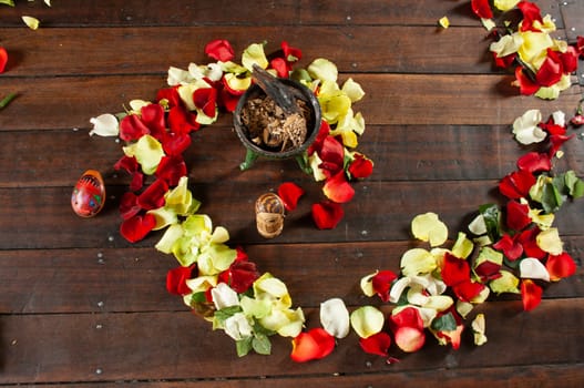 flower arrangement in the form of a spiral of red and yellow colors on the ground to perform an indigenous ritual. High quality photo