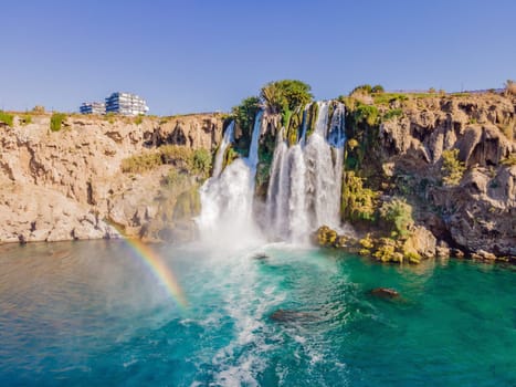 Lower Duden Falls drop off a rocky cliff falling from about 40 m into the Mediterranean Sea in amazing water clouds. Tourism and travel destination photo in Antalya, Turkey. Turkiye