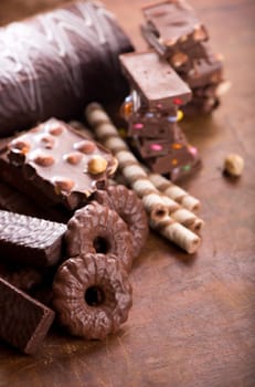 gingerbread cookies and chocolate on a wooden background