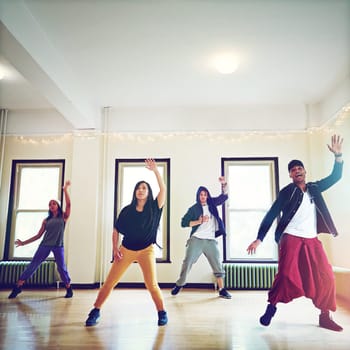 Dancing their way to stardom. a group of young people dancing together in a studio