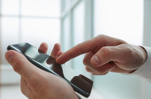 Businessman using phone for celling and texting on her mobile phone