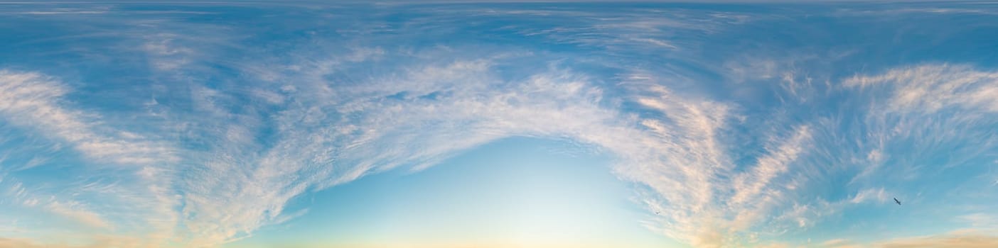 Bright sunset sky panorama with Cirrus clouds. Seamless hdr spherical equirectangular 360 panorama. Sky dome or zenith for 3D visualization, game and sky replacement for aerial drone 360 panoramas.