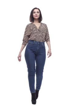 in full growth. an attractive young woman in jeans. isolated on a white background.