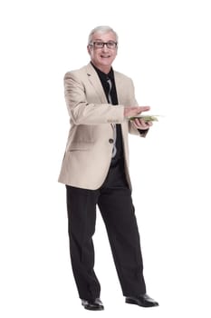 in full growth. happy intelligent man with banknotes. isolated on a white background.