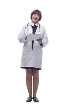 in full growth. female doctor with a digital tablet . isolated on a white background.