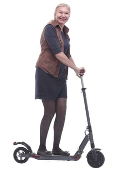 in full growth. happy woman with a comfortable electric scooter. isolated on a white background
