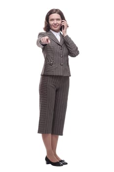 in full growth. modern business woman with a smartphone. isolated on a white background.