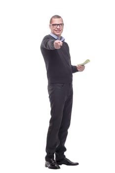 Portrait of a business man with hand in his pocket and holding money, isolated on white