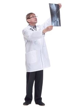 in full growth. attending doctor with an x-ray of his patient. isolated on a white background.