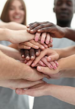 close up. young people making a tower of hands. the concept of unity