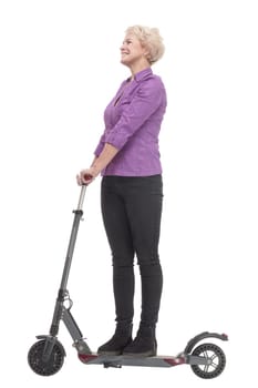 in full growth. smiling mature woman with an electric scooter . isolated on a white background.