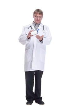 in full growth. doctor expert using hand antiseptic. isolated on a white background.