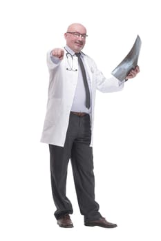 full-length. mature doctor with x-ray .isolated on a white background.