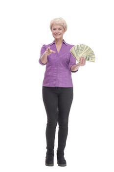 in full growth. happy mature woman with banknotes. isolated on a white background.