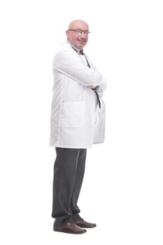 in full growth. successful mature doctor in a white coat .isolated on a white background