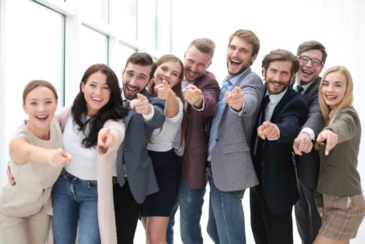 group of successful young people pointing at you. concept of choice