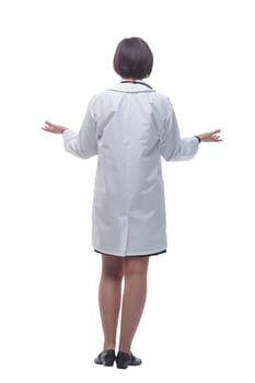 rear view. female doctor looking at a white screen. isolated on a white background.