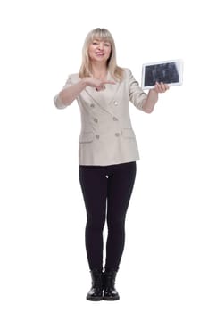 in full growth. attractive woman pointing on her digital tablet . isolated on a white background.