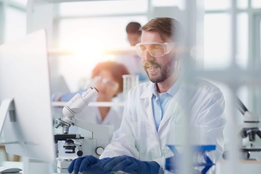 Focused male scientist working in laboratory