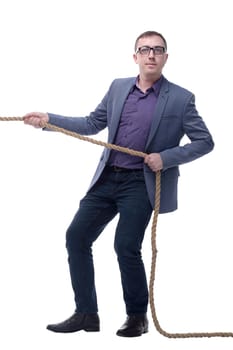 Handsome businessman in glasses pulling a rope isolated on white background
