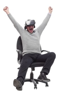 in full growth. smiling man in virtual reality glasses. isolated on a white background.