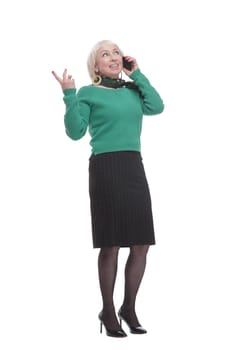 attractive woman with a smartphone and a takeaway coffee. isolated on a white background.