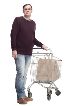 full-length. casual man with shopping cart. isolated on a white background.