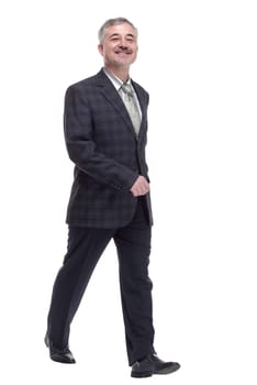 in full growth. confident adult male striding forward . isolated on a white background