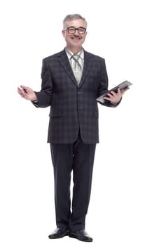 in full growth. business man making an entry in the clipboard. isolated on a white