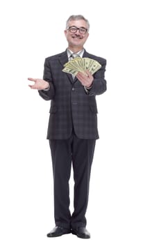 in full growth. happy man with cash bills showing thumbs up. isolated on a white