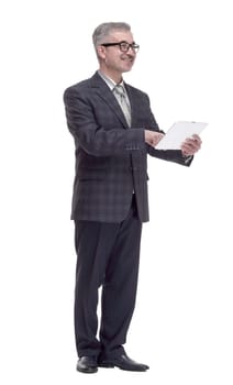 in full growth. smiling man using a digital tablet. isolated on a white background