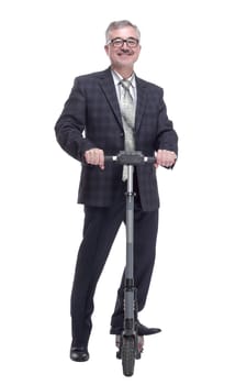 in full growth. Mature man with electric scooter showing thumbs up. isolated on a white