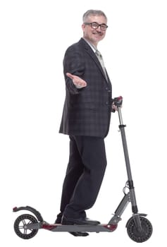 side view. friendly adult male with an electric scooter. isolated on a white background
