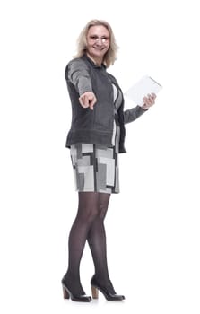 in full growth. a contented young woman with a digital tablet pointing at you . isolated on a white