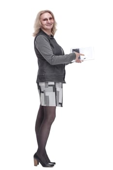 side view. casual young woman using a digital tablet . isolated on a white background