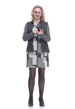 in full growth . casual young woman with a smartphone . isolated on a white background