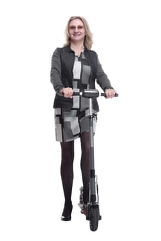 in full growth. a smiling young woman with an electric scooter. isolated on a white background