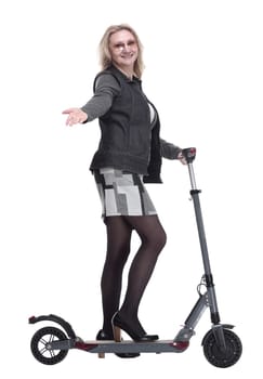 side view. modern young woman with an electric scooter. isolated on a white