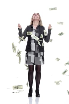 in full growth. happy young woman standing in the rain of money. isolated on a white